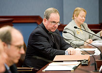 Rep. John Taylor listens to Dan Kildee testify in favor of Taylor’s bill to create land banks as a way to rescue abandoned properties. Kildee is a leading national expert on land banking.